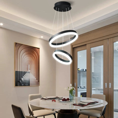 Elegant dining area with Two Ring Modern LED Chandelier In Black, Sleek Contemporary Ceiling Pendant Light For Staircase, Foyer, High Ceilings Or Living Room, 6000K Cool White, Dimmable And Adjustable Pendant Lighting.