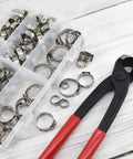Beefy Heavy Duty PEX Clamp Kit With Cinch Pliers, 130 Piece Stainless Steel Crimp Rings And Clamp Set For PEX Tubing on wooden background