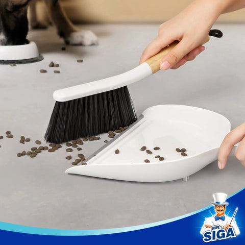 Portable Dustpan and Brush Set With Bamboo Handle in White for quick cleanups, shown sweeping debris into dustpan.
