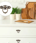 Set Of 6 Vintage Zinc Alloy Drawer Pulls And Retro Round Cabinet Knobs, bronze finish, installed on white dresser in kitchen scene