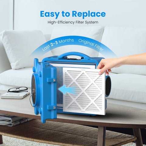 Person inserting MERV-10 Filter Replacement Set For S-550 Air Scrubber into blue air scrubber unit in living room.