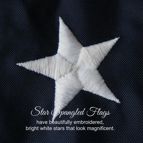Close-up of embroidered white star on navy blue nylon fabric for Made In USA Heavy Duty 3x5 Outdoor Flag, 100 Percent Nylon With Embroidered Stars And Sewn Stripes, Extra Quadruple Stitching On Fly End, Built To Last Outdoor Flag For Outside Use With Brass Grommets And Weather Resistant.