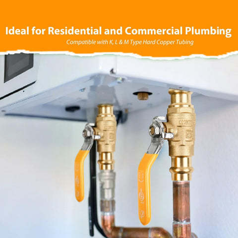 Two 1/2-inch brass ball valves with orange handles installed on copper pipes