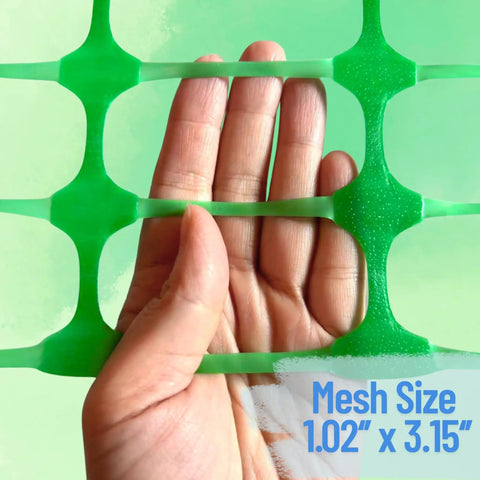 Close-up of green mesh from Extra Strength Plastic Fence With Stakes 40 Inch By 100 Foot Roll Green Heavy Duty Temporary Fence.
