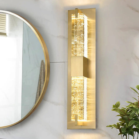 Hot Gold 19 Inch LED Wall Sconce With Crystal Bubble Glass mounted in bathroom next to mirror