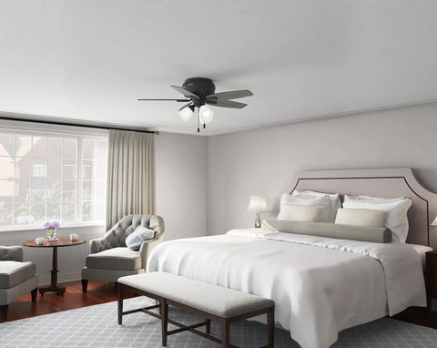 42 Inch Indoor Ceiling Fan With LED Light Kit, Matte Black, 5 Blade, Low Profile Flush Mount in bedroom setting, pull chain visible