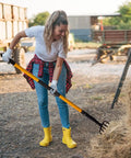 Heavy Duty Garden Pitch Fork With 5 Tines And Fiberglass Handle 58 Inches used by gardener for hay