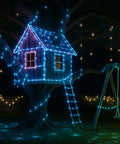 Treehouse wrapped in 132ft LED Rope Lights Outdoor Waterproof Color Changing String Lights With Remote, night view.