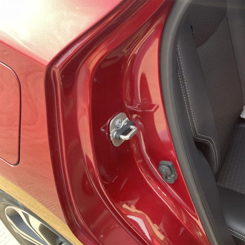 Close-up of Nissan car door showing Premium Sound Damper Door Lock Buffers to beat rattling and noise.
