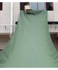 Heavy Duty Canvas Chute For Cargo Loading And Unloading From Warehouse To High Rise in use, 10m length, green canvas