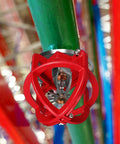 Tough As Nails Fire Sprinkler Head Guard Cover Bump Proof Protector Cage on green pipe, designed for safety systems.