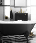 Heavy Duty 1-1/2 Inch Adjustable Pop Up Bath Drain With Solid Brass Tailpiece Slick Trip Lever Design Built Tough For Vintage Freestanding And Whirlpool Tub Setups Straight Forward Install And Drip Free Flow in black freestanding tub with gold fixtures.