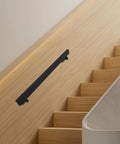 Black Stainless Steel Wall Mount Handrail for Stairs and Hallways mounted on wooden wall with steps visible.