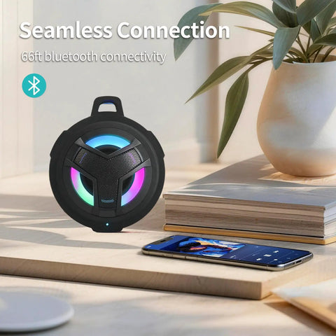 Bluetooth Shower Speaker With LED Light, IP67 Waterproof And Floating, 2000mAh Battery, True Wireless Stereo, shown on table