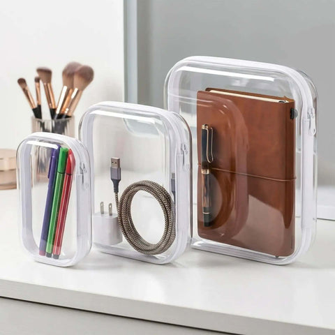 Heavy Duty Six Pack Clear Hard Shell Zipper Cases with pens, charger, notebook, and cable for travel and organization.