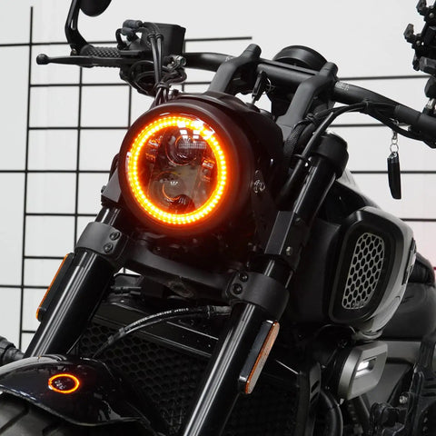 5.75 Inch Black Motorcycle Headlight With Smoked Amber Halo DRL And Matte Black Housing Includes 32 To 40 Mm Fork Tube Side Mount Brackets Fits Most Motorcycles From Cruisers And Cafe Racers To Choppers