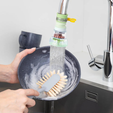 Person using 360 Rotating Faucet Filter Extenders Set For Sink Direct Water Flow And Splash Reduction on kitchen tap.