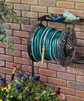NeverLeak Decorative Wall Mount Hose Reel in brown holding 125 ft of 5/8 inch hose on a brick wall with plants