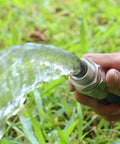Heavy Duty 3/4 Inch Garden Hose Repair Kit with Stainless Steel Male and Female Ends in use spraying water