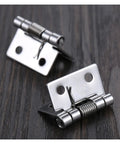 Set of 8 Self Closing Spring Door Hinges 25mm 1 Inch Stainless Steel Hardware with smooth closure on wood surface