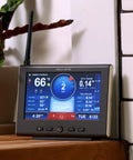All In One Weather Station With Rain Gauge And Wind Speed Direction Indoor Outdoor Thermometer with HD display on a shelf