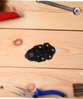 8 Piece Metal Buckle Kit With Duckbilled Toggle Latch on wooden surface with tools displayed around.