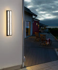 Slick 18W Outdoor Wall Light Modern Exterior Fixture IP65 Waterproof Sconce on house exterior at dusk