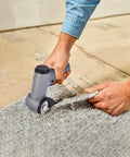 User operating Selumie 2026 New Cordless Electric Scissors, 4V Rechargeable Cardboard Cutter on grey carpet.