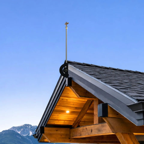Heavy Duty Adjustable Roof Sprinkler System for Wildfire Protection prewets eaves gutters, shown on a wooden roof peak.