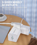 Six In One Power Strip With Surge Protection Three AC Outlets Two USB C Ports 65W Fast Charging placed on a table