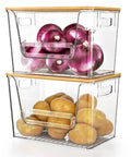 No Fuss Pantry Organizers With Bamboo Lids And Heavy Duty Trash Bag Dispenser For Four Through Thirteen Gallon Rolls Stackable Under Sink Storage Bins holding onions and potatoes.