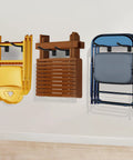 Wall mounted folding chair storage rack with adjustable width beefed up organizer holding yellow, brown, and blue chairs in garage.