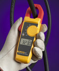 Pro Grade Clamp Meter For Electricians With True RMS Readings, Measures AC Current To 400 A, held in a gloved hand