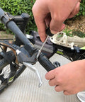 Person using Pink 39 Piece All Purpose Household Tool Kit Set for Women for bike repair with screwdriver.