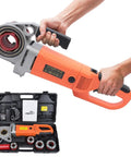 Qiokoith Heavy Duty Electric Pipe Threader 2300w with six changeable dies held in hand, showing copper motor and portable design.