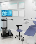 Heavy Lifter Mobile Workstation Cart With No Sweat Rolling Casters And Fully Adjustable Gas Spring Monitor Stand Plus Secure CPU Tray For Seamless Standing Desk Transitions In Matte Black in a dental office setting.