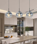 Dope Modern Black Globe Pendant Lights Two Pack over kitchen island, glass silver gradient orbs, warm glow ceiling fixture
