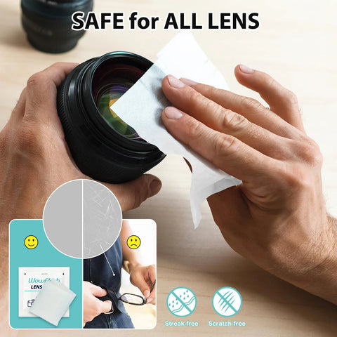 Eyeglass lens cleaning wipes, pre-moistened white sheets, used to wipe a camera lens from a black canister.