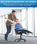 Heavy Duty Rollerblade Office Chair Wheels Replacement Set Of 5, 2 Inch Rubber Casters Designed For Carpet Or Hardwood Floors, Universal Standard Stem Fit, Loaded To Carry Up To 2000 Lbs Without Skipping A Beat, Glides Smooth And Silent Daily. Woman joyfully rolling in office chair on carpet with casual man behind.