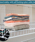 Stacked clothes separated by Twenty Pack Wire Closet Shelf Dividers With 100 Nylon Ties, 12 Inch Vertical Organizers