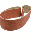 Heavy Duty 2 By 36 Ceramic Sanding Belts For Grinding Deburring And Metal Finishing With 120 Grit Cloth Backing rolled for use.