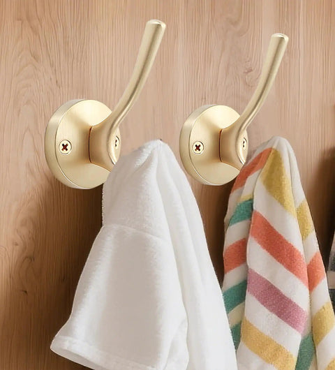 Gold Hat And Coat Hooks 4 Pack Heavy Duty Metal Wall Mounted Hangers For Coat Backpack Towel And Accessories In Bathroom Entryway Closet Or Garage Built From Rust Resistant Zinc Alloy With 40 Lb Capacity holding towels.