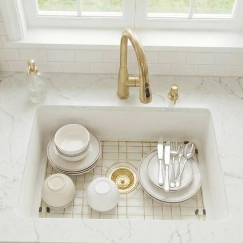 Gold Stainless Steel Sink Grid For Kitchen Sinks 26 1/8 By 14 1/16 Inches Center Drain Hole durable grid in use with dishes.