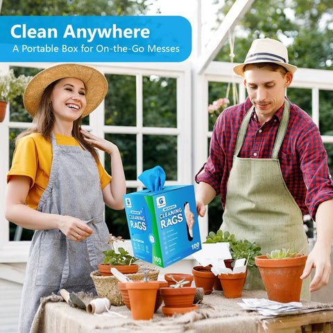 Front view of blue microfiber cleaning rags box (100-count) held by a man and woman in aprons.
