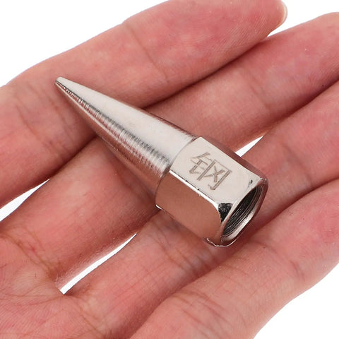 Close-up of a steel nozzle from Five-Piece Steel Grease Nozzle Replacement Tips Kit For Equipment And Machinery on a hand.