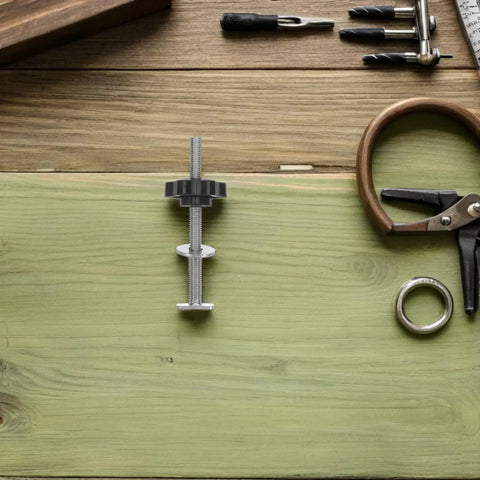 Four Star Shaped T Track Knobs with stainless bolts and washers on wooden surface for woodworking fixtures