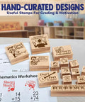 Slick Music Teacher Grading Stamps With Bold Red And Black Ink Pads And Convenient Refill Pack For Quick Classroom Feedback That Is A Total Class Saver And Major Game Changer on a desk with grading paper, showcasing wooden handles and motivational designs.