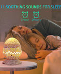 Mother and daughter sleeping with the 4 In 1 Aurora Galaxy Projector With Bluetooth Speaker White Noise Night Light And Moving Stars For Bedroom Decor Kids And Adults Beaming Northern Lights Ambience For Sleep And Christmas Vibes Beige Finish.