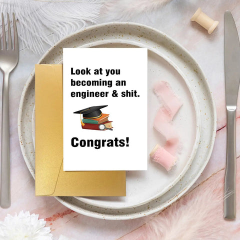 Funny Engineer Graduation Card For The New Grad With Blank Inside for personal message, 8 by 5.3 inch card on a plate with gold envelope
