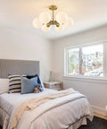 Cozy bedroom with Brushed Gold Sputnik Flush Mount Ceiling Light With Six Milk Glass Globes, Mid Century Modern Overhead Fixture